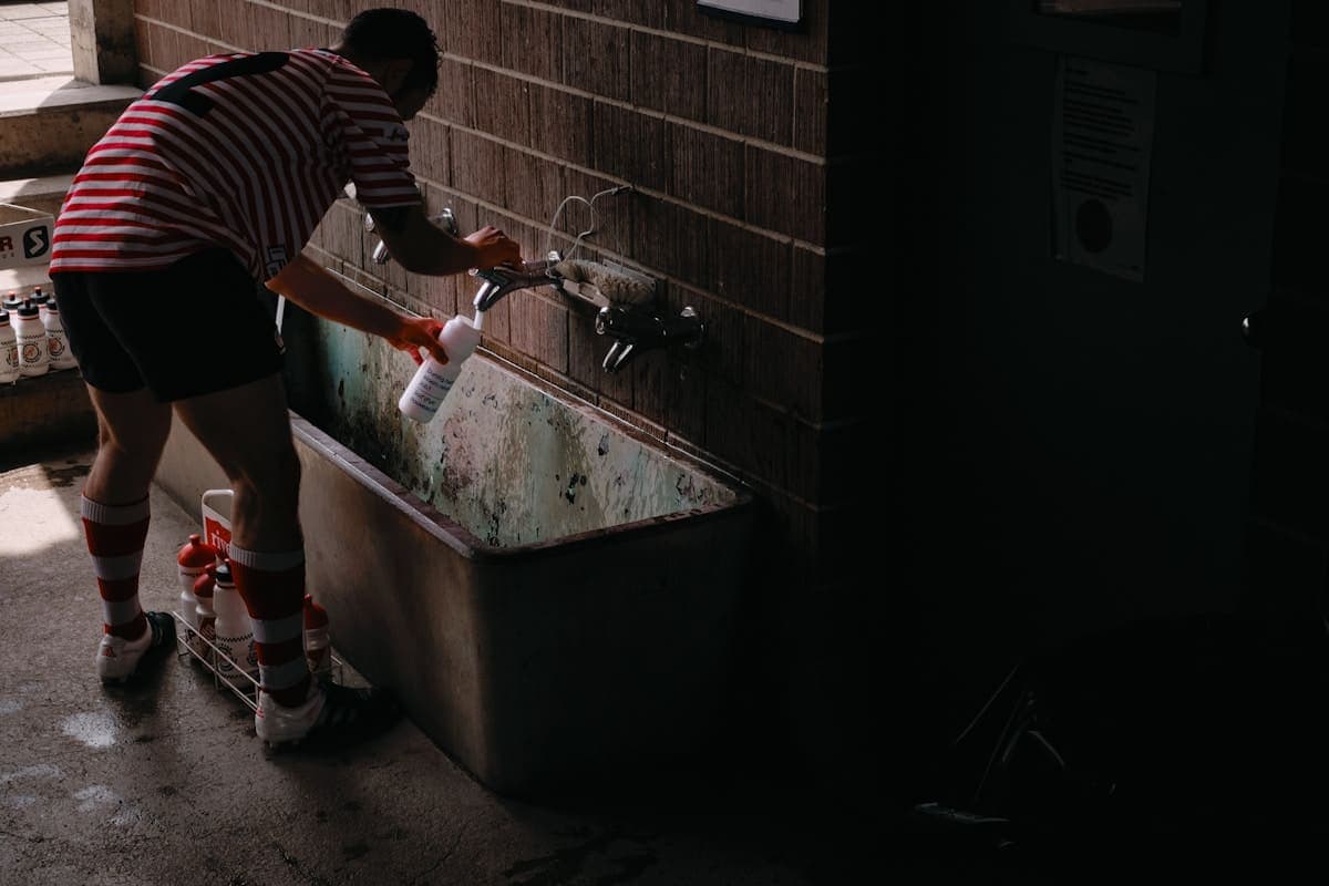 Emergency Drain Cleaning - professional plumber on the job