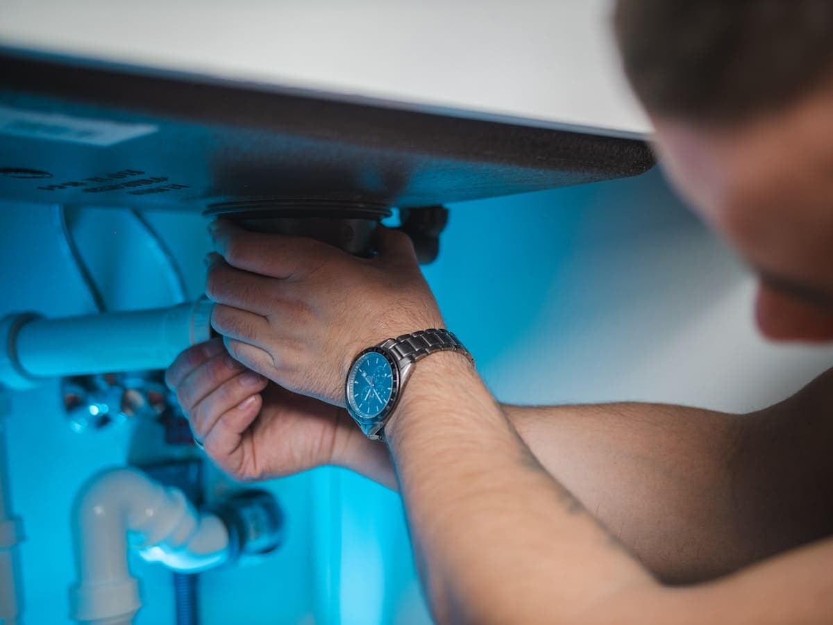 Water Heater Emergency - professional plumber on the job